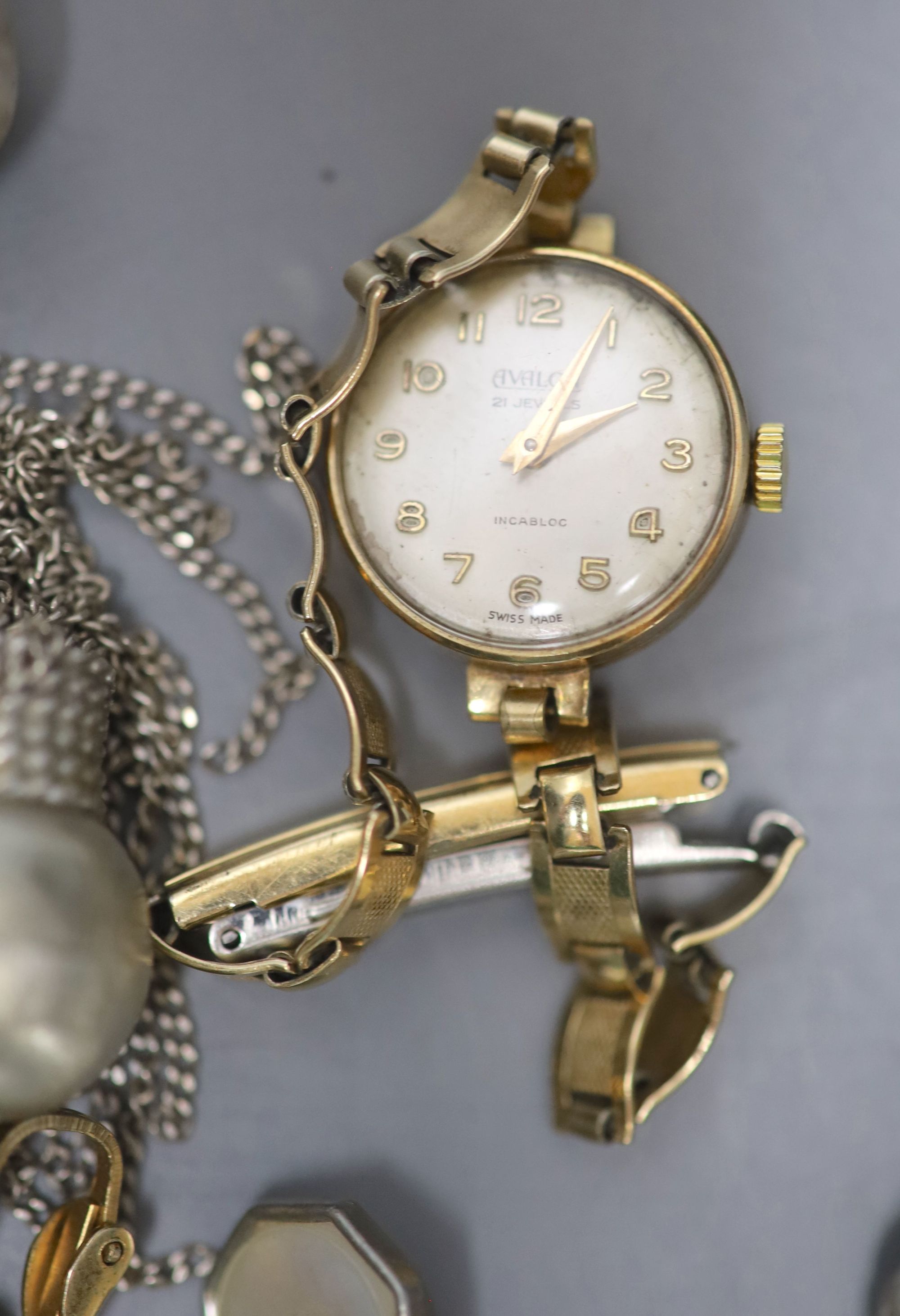 A ladys 9ct gold wrist watch on a plated strap, a Citizen Eco Drive watch, a cased six piece white metal and mother of pearl...